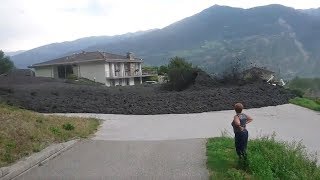 Mudslide barrels through Swiss town [upl. by Ynaoj]