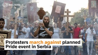 Protesters march against planned Pride event in Serbia [upl. by Auof]