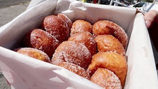 Dozen Malasada Challenge Leonards Bakery [upl. by Alekat984]