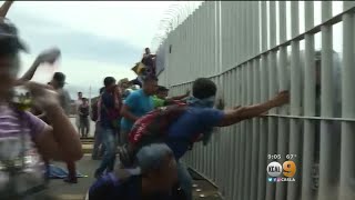 Mexico Border Gate Torn Down As Migrant Caravan Heads North Towards US [upl. by Bornie]