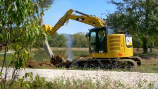 The Cat® 315F Hydraulic Excavator Clearing Land [upl. by Artemla562]