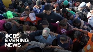 Migrant caravan reaches southern US border [upl. by Haliehs]