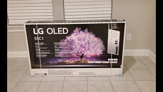 LG OLED C1 Unboxing Assemble Setup and First Impressions [upl. by Cheng]